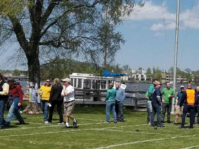people having fun on lawn during Bocce Beer and Bites event