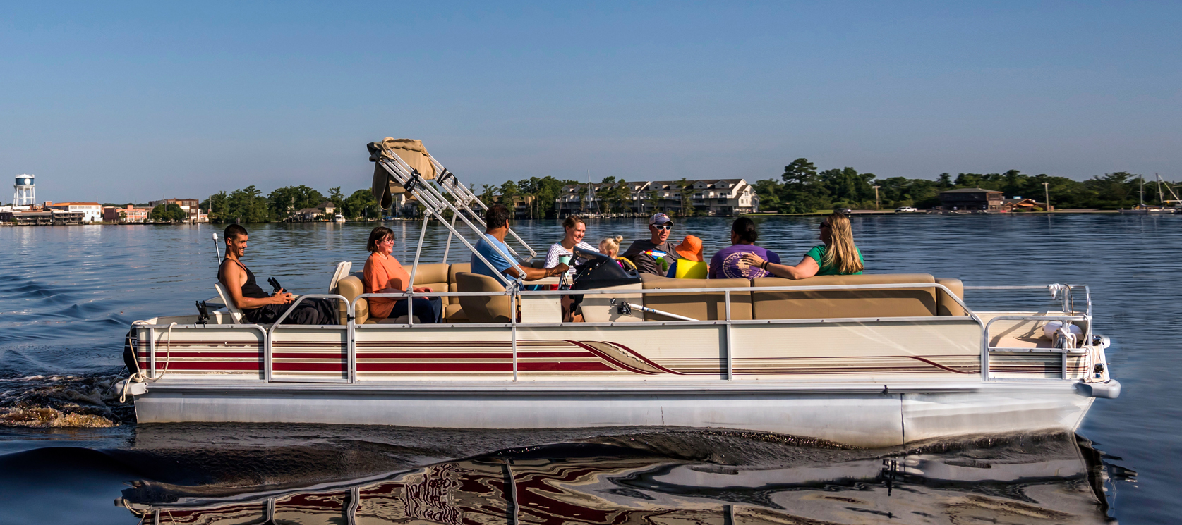 family riding Pontoon boat on pasquotank river