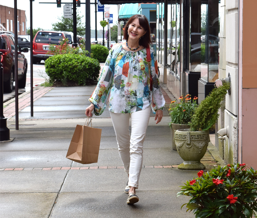 happy woman holding shopping bags Downtown Elizabeth City Shopping