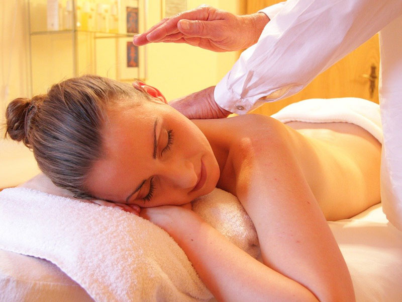 woman relaxing and getting back massage