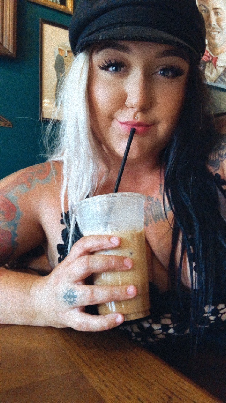local artist with two tone hair drinking iced coffee in Elizabeth City, NC