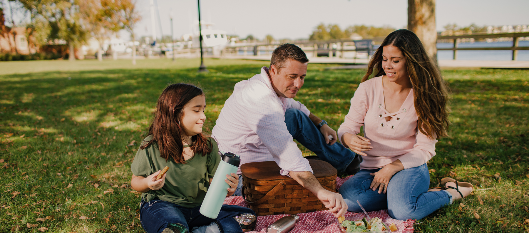 family having a picnic on the green at Waterfront Park in Elizabeth City, North Carolina