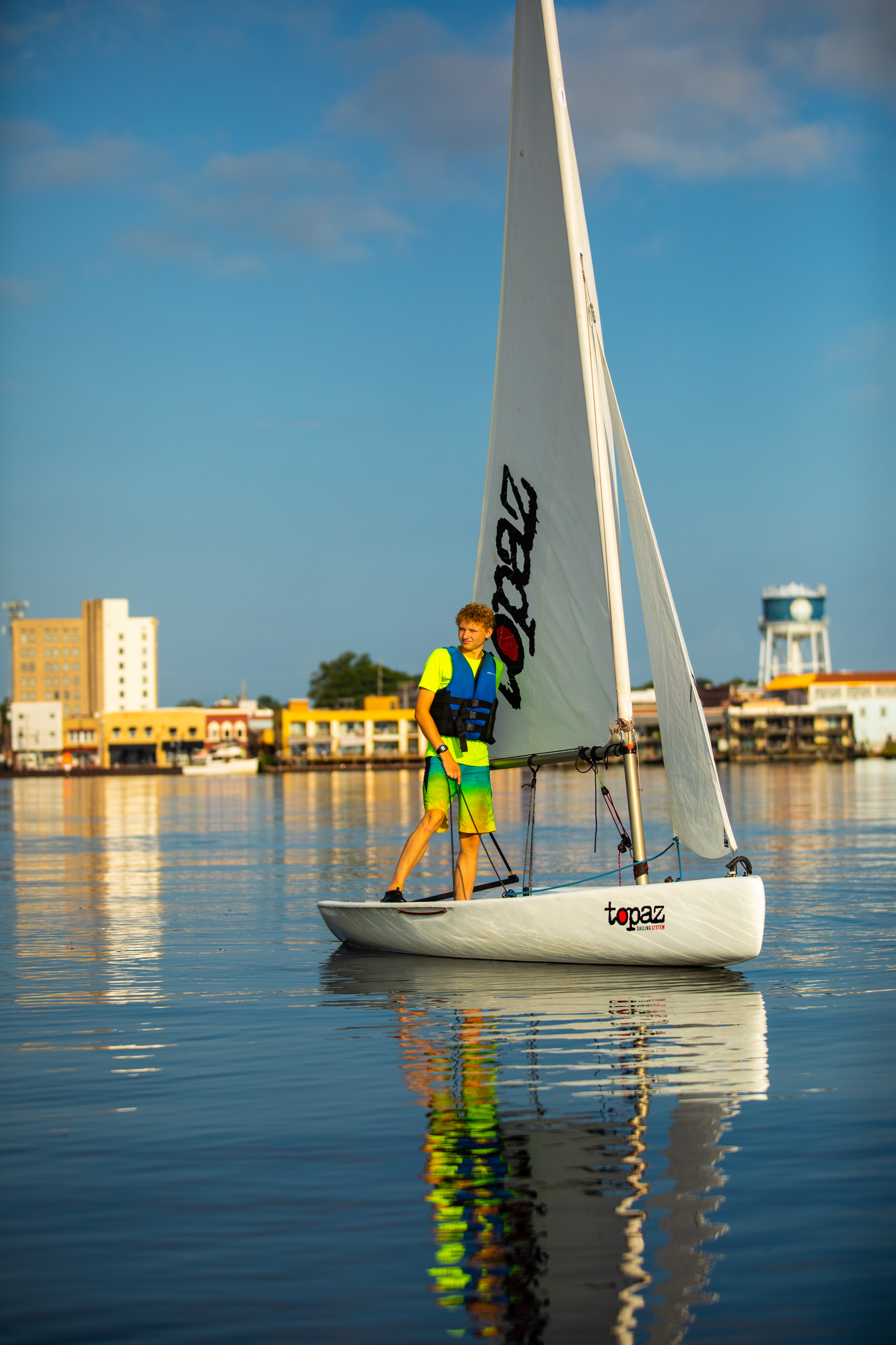 boy on sailboat, pasquotank river, shoreline elizabeth city